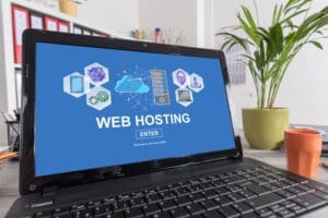 a laptop with web hosting on the screen
