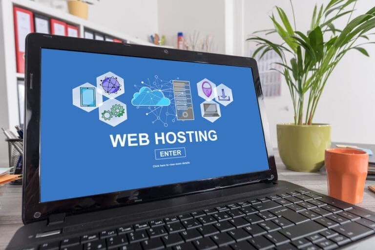 a laptop with web hosting on the screen