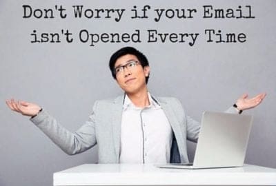 a man sitting in front of a laptop computer