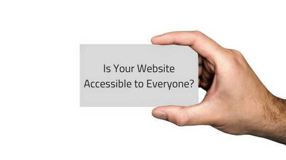 a hand holding a card that says is your website accessible to everyone?