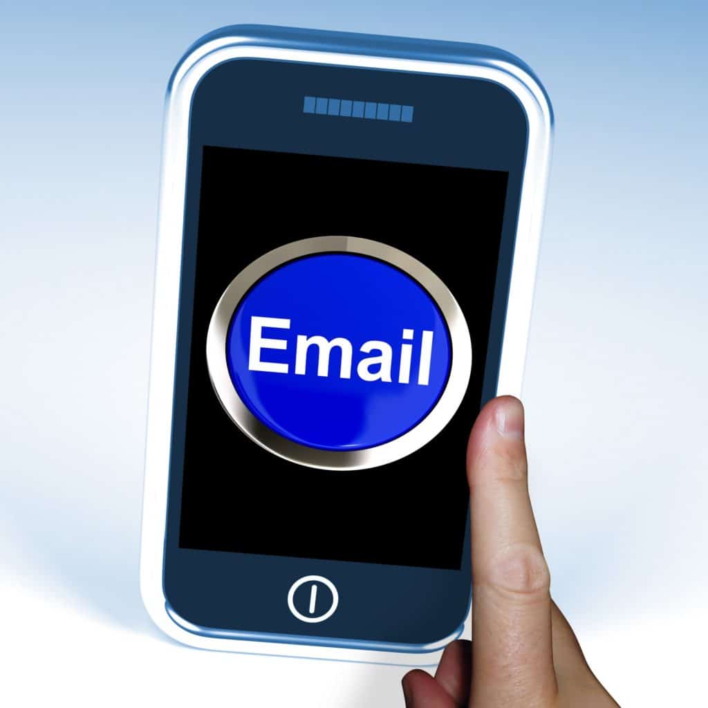 a hand holding a cell phone with an email button on it