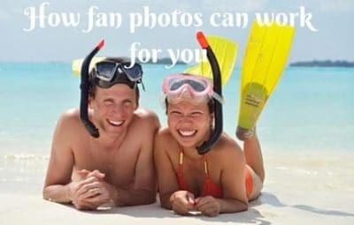 two people laying on the beach with their heads covered by snorkels