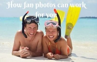 two people laying on the beach with their heads covered by snorkels