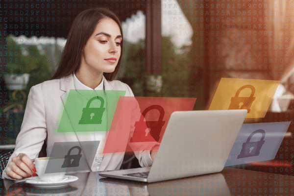 a woman sitting in front of a laptop computer