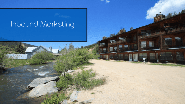 a blue sign that says inbound marketing above a river