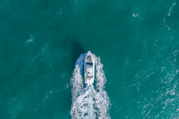 an aerial view of a boat in the ocean